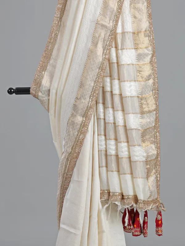 Off white silk saree with resham weaving