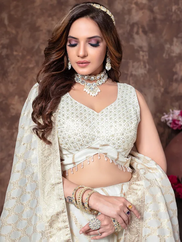 Off white tissue silk lehenga choli for wedding events