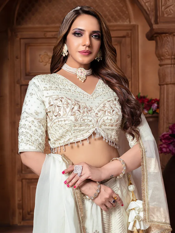 Off white tissue silk lehenga choli in traditional design