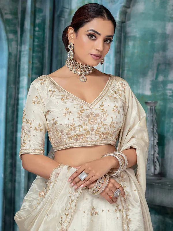 Off white tissue silk lehenga choli with pearls