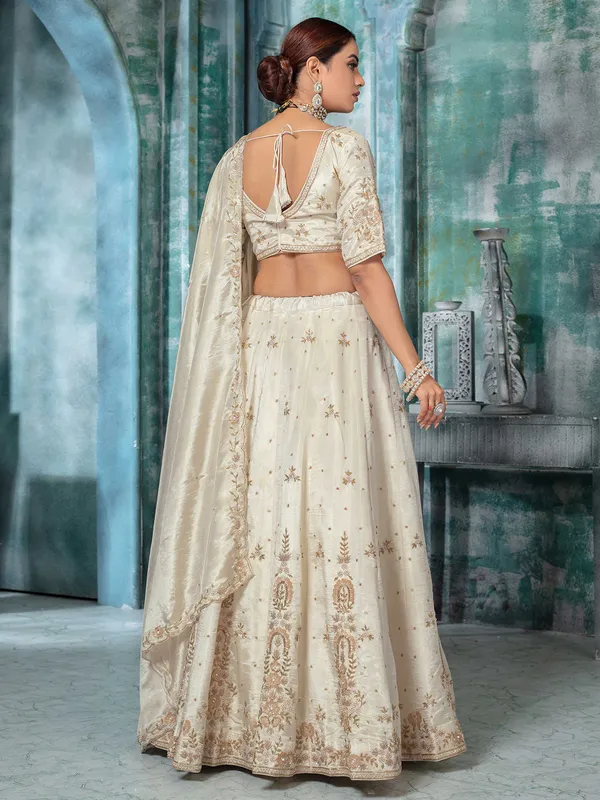 Off white tissue silk lehenga choli with pearls