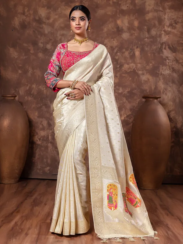 Off white tissue silk saree in zari weaving