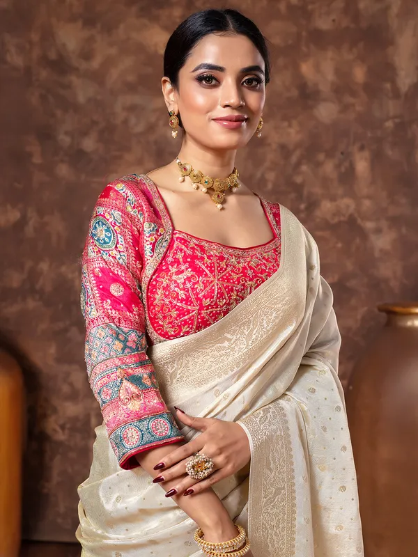 Off white tissue silk saree in zari weaving