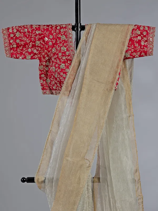 Off white tissue silk saree with elegant embellishments