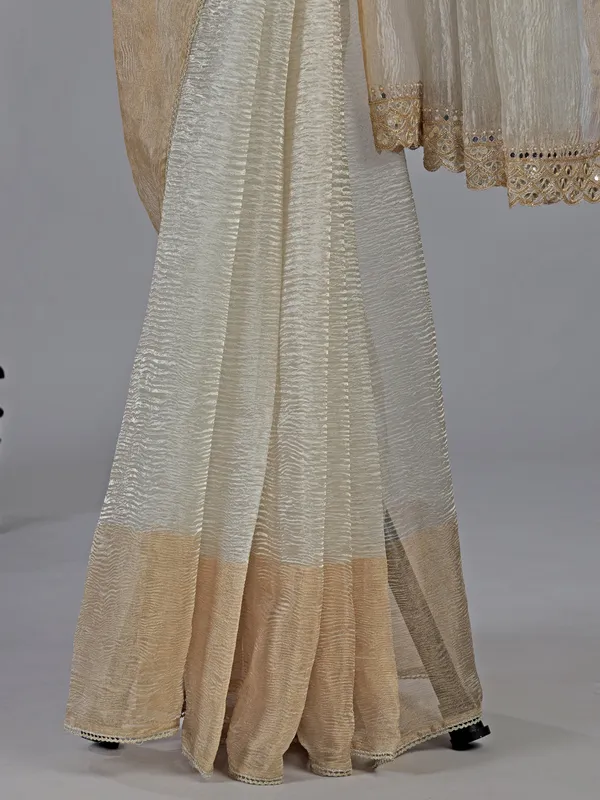Off white tissue silk saree with elegant embellishments