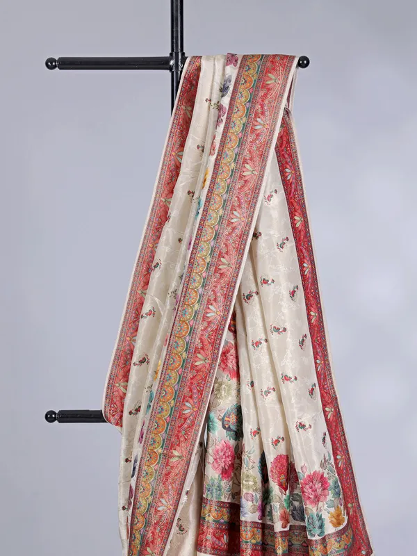 Off white tissue silk saree with floral accents