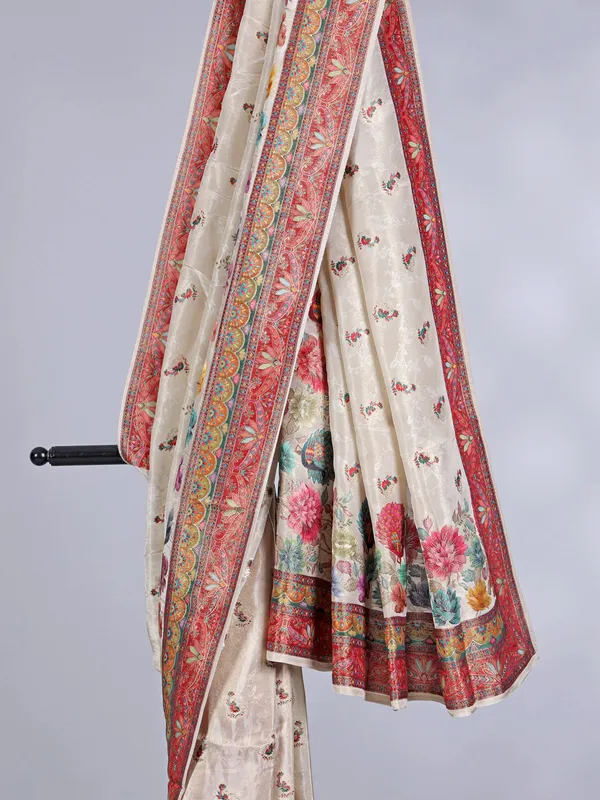 Off white tissue silk saree with floral accents