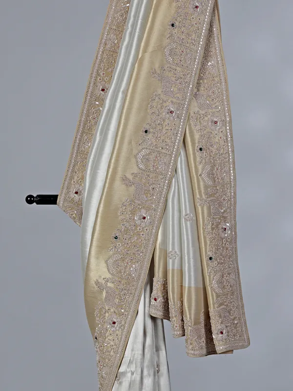 Off white ziraf silk saree with heavy border
