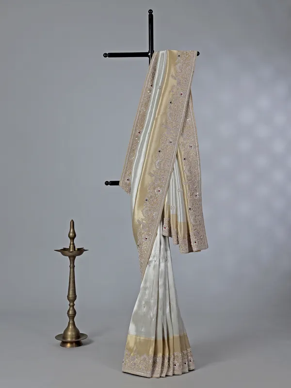 Off white ziraf silk saree with heavy border