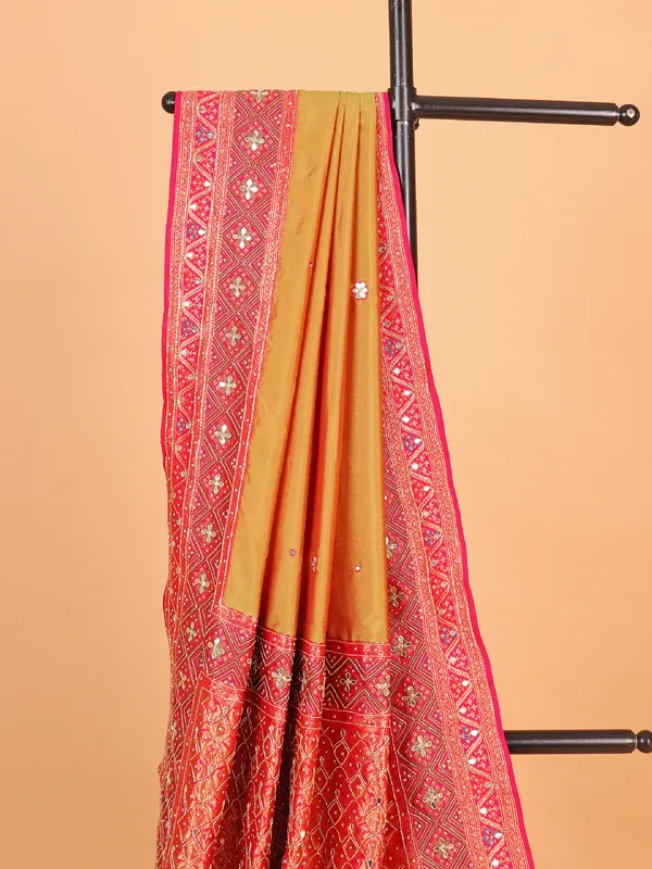 Olive art silk saree with contrast border and pallu