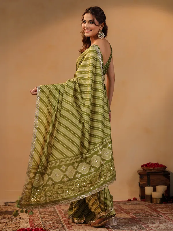 Olive printed silk saree with gota embellishment