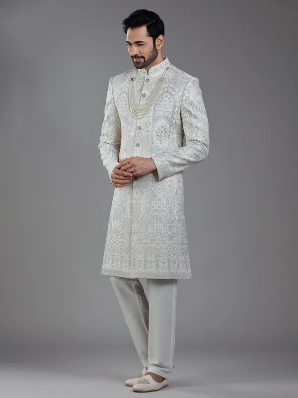 Opulent elegance in cream silk with artistic embroidery and resham