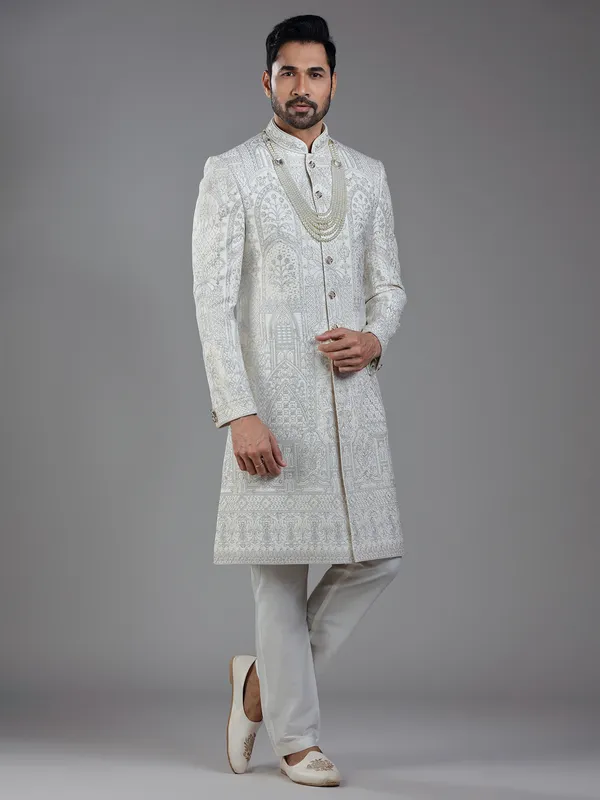 Opulent elegance in cream silk with artistic embroidery and resham