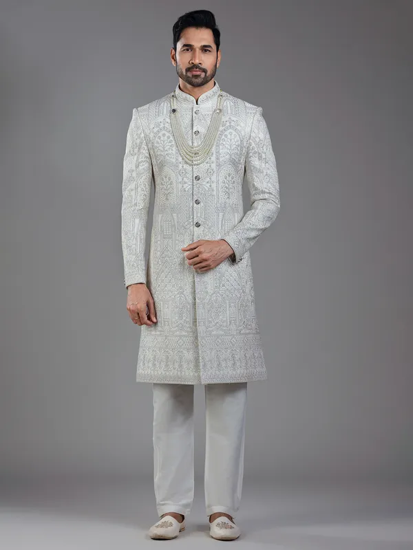 Opulent elegance in cream silk with artistic embroidery and resham