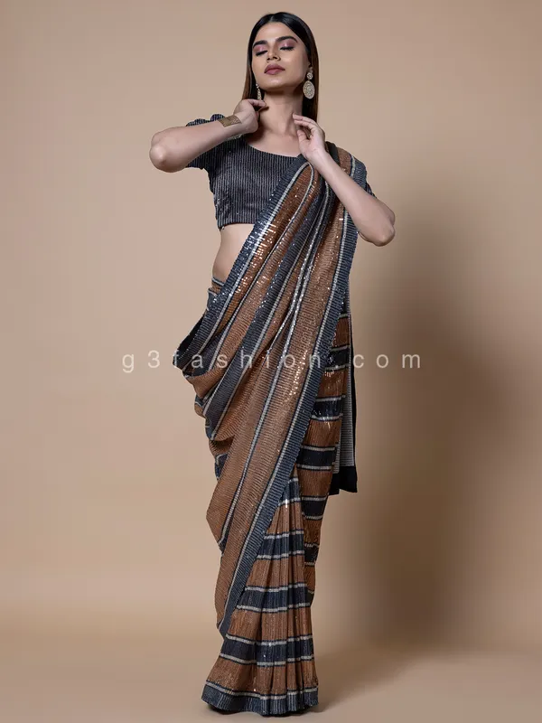 Orange and black stripe pattern sequins saree