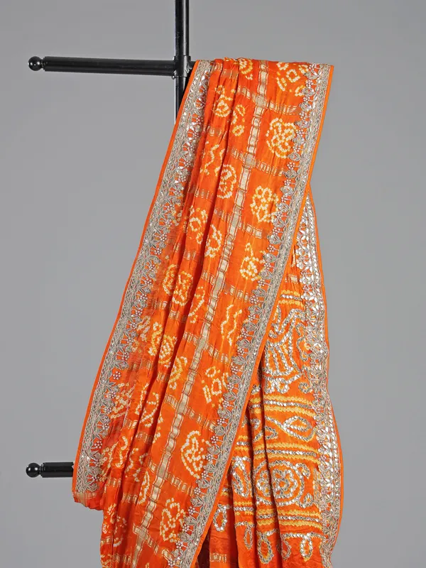 Orange bandhani saree with beaded detailing