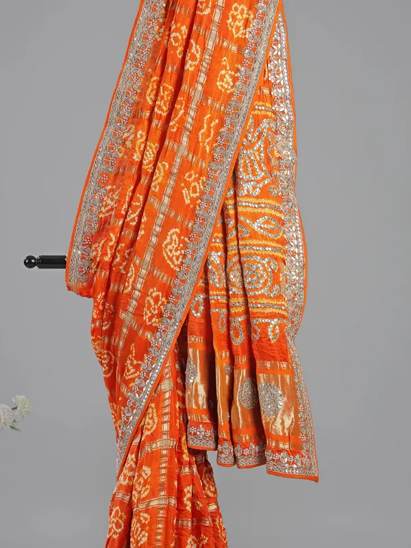 Orange bandhani saree with beaded detailing