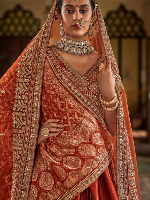 Orange bridal silk lehenga choli with embroidery