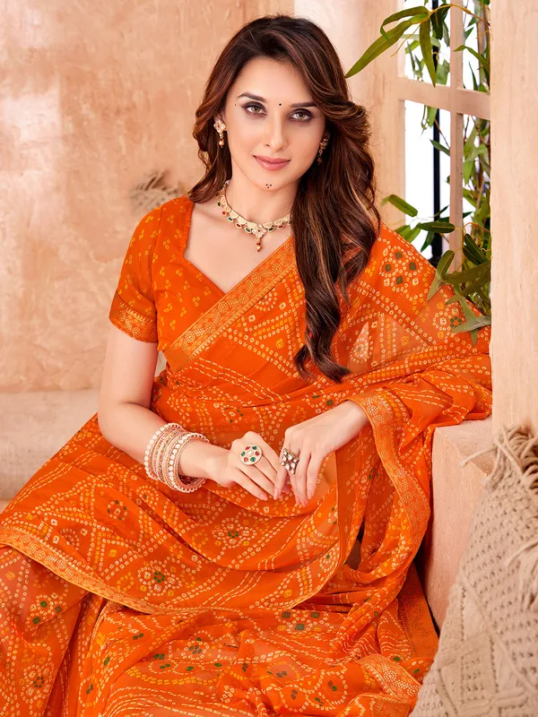Orange chiffon saree with bandhej print