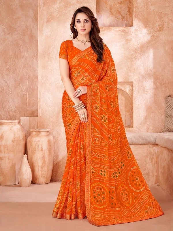 Orange chiffon saree with bandhej print