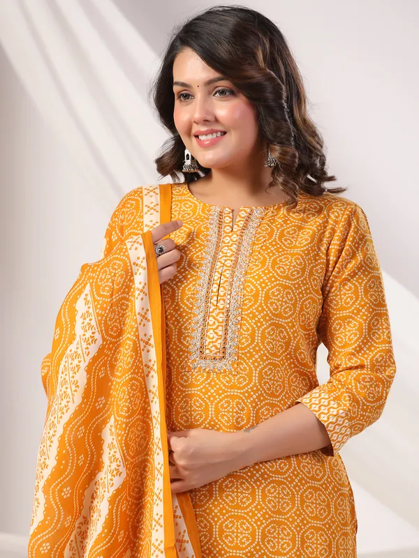 Orange color silk kurti set in printed