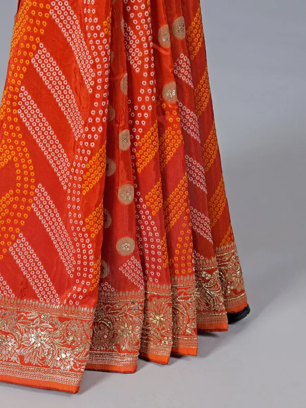 Orange dola silk saree with bandhej print