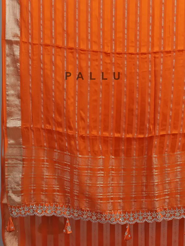Orange organza satin saree with stone studded blouse