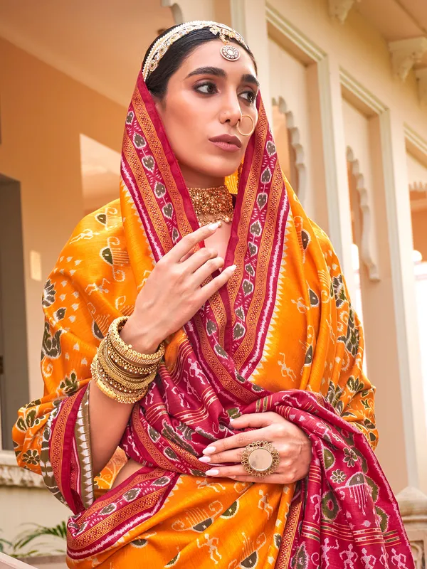 Orange printed silk saree for wedding wear