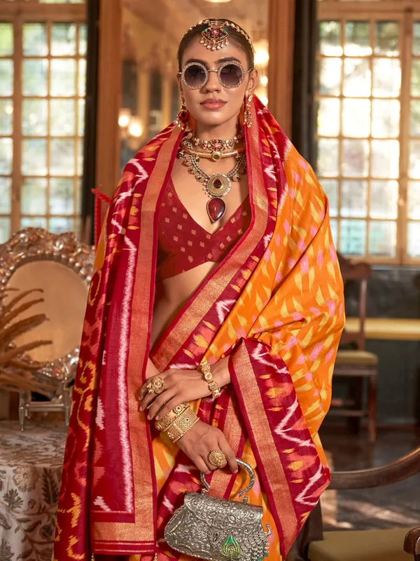 Orange printed silk saree with maroon pallu