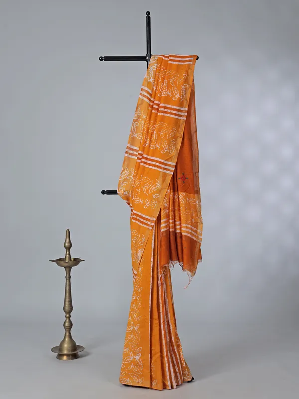 Orange printed tusser silk saree with thread work