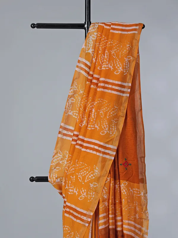 Orange printed tusser silk saree with thread work