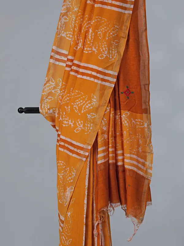 Orange printed tusser silk saree with thread work