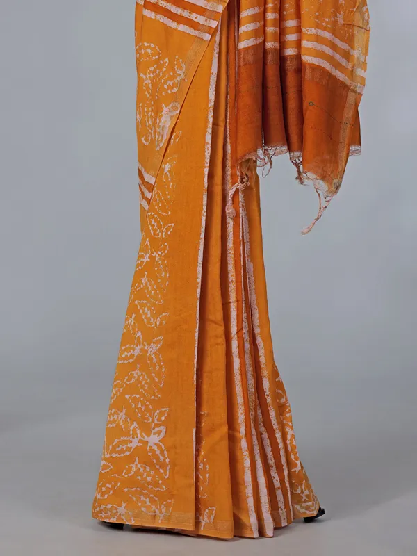 Orange printed tusser silk saree with thread work