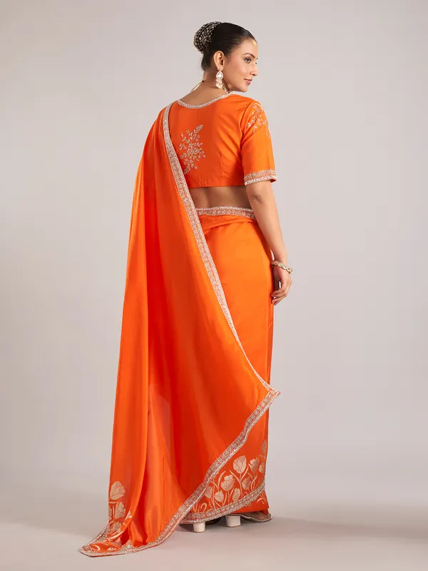 Orange pure dola silk saree with festive detailing