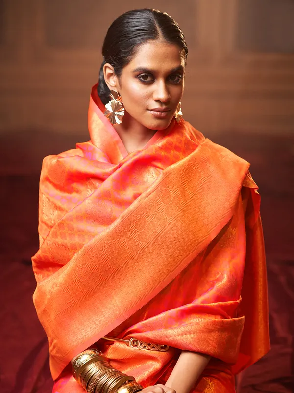 Orange shaded silk wedding look saree