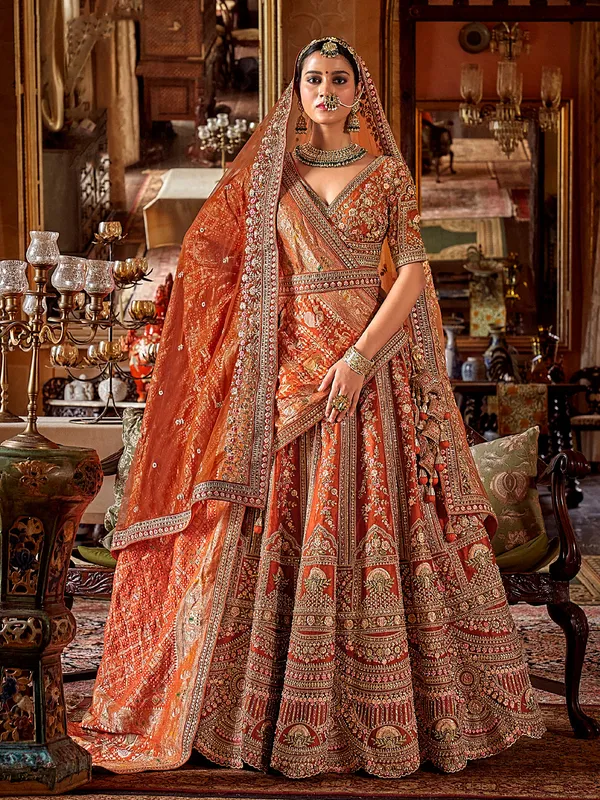 Orange silk bridal lehenga choli with sewuins work