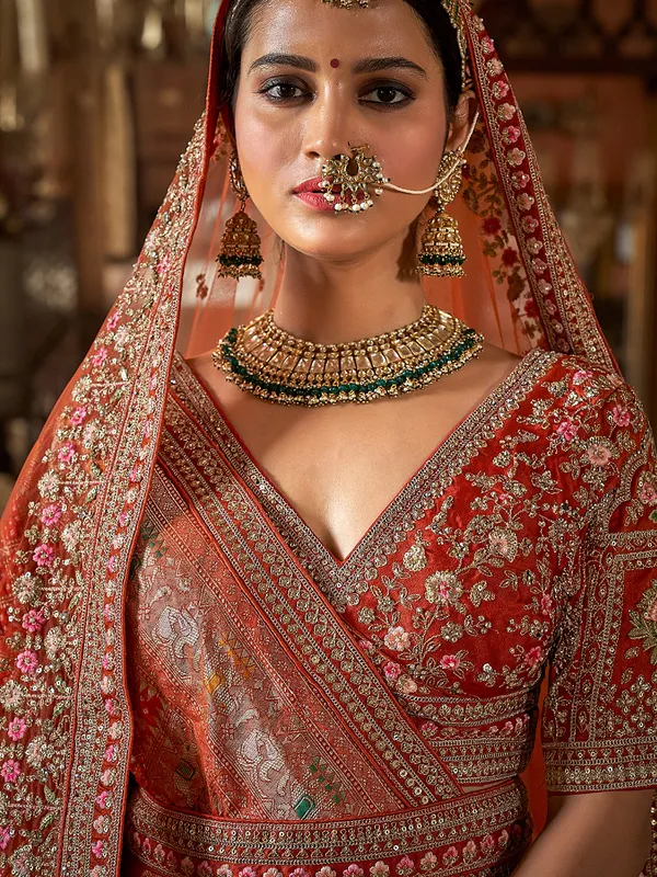 Orange silk bridal lehenga choli with sewuins work
