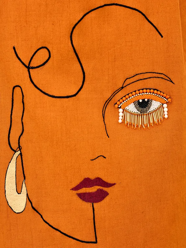 Orange silk ensemble with stone highlights