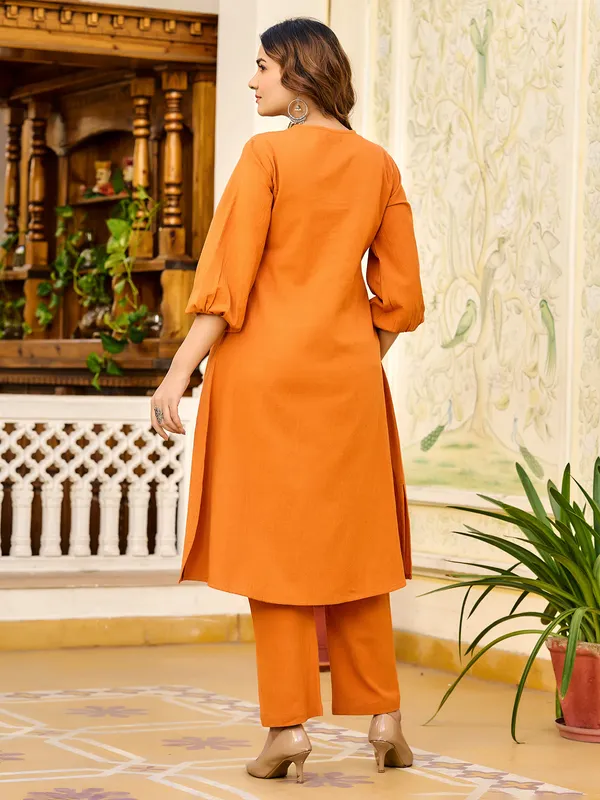 Orange silk ensemble with stone highlights