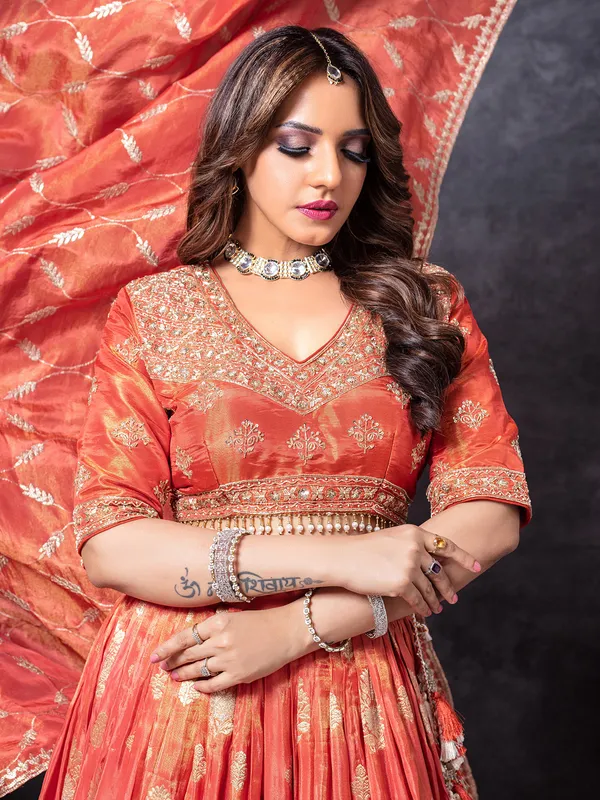Orange silk sequins worked lehenga choli