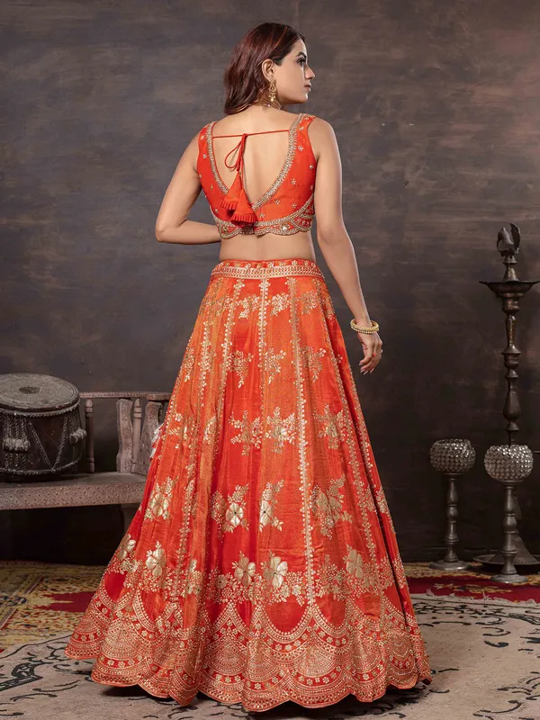 Orange sleeveless lehenga choli with dupatta