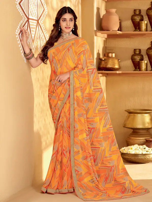 Orange trendy georgette saree in printed