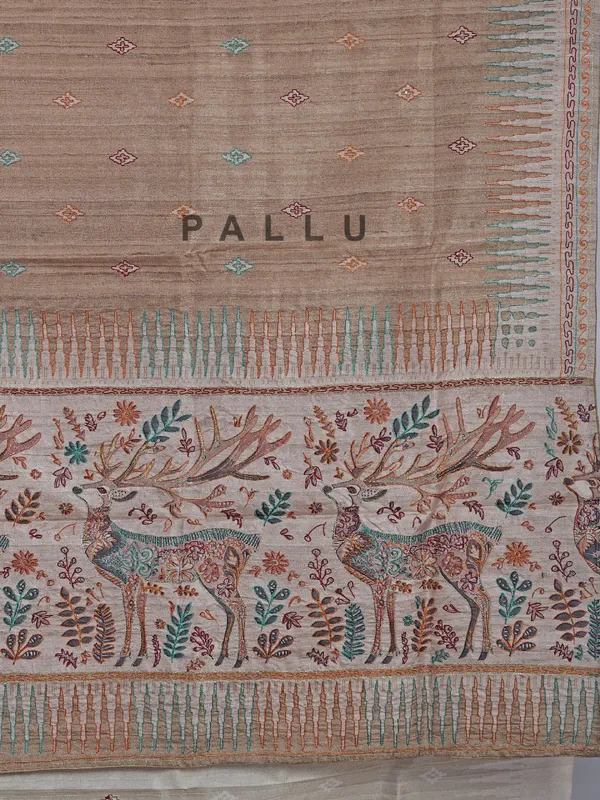 Pastel beige silk saree with intricate thread detailing
