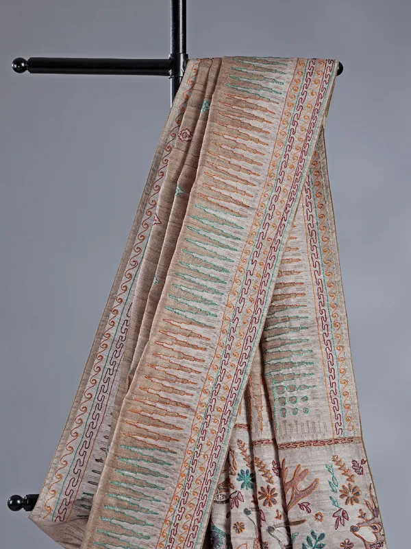 Pastel beige silk saree with intricate thread detailing