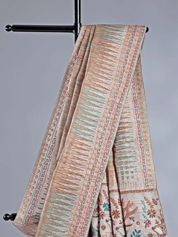 Pastel beige silk saree with intricate thread detailing