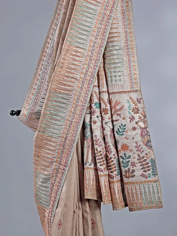 Pastel beige silk saree with intricate thread detailing