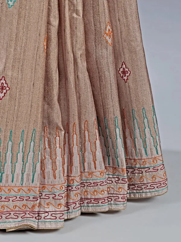 Pastel beige silk saree with intricate thread detailing