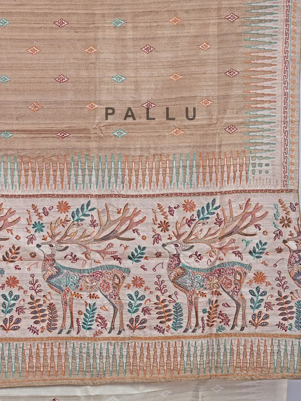 Pastel beige silk saree with intricate thread detailing