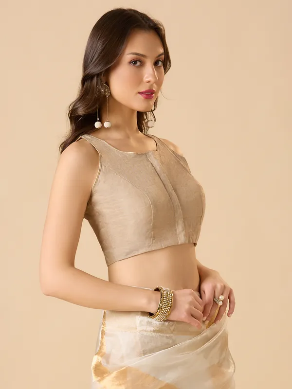 Pastel beige tissue silk solid sleeveless ready made blouse