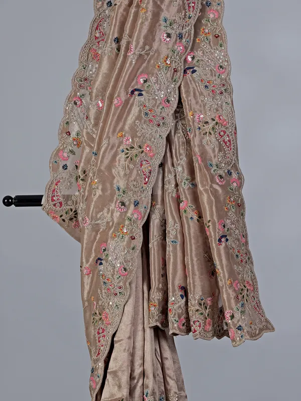 Pastel beige tissue silk wedding wear saree